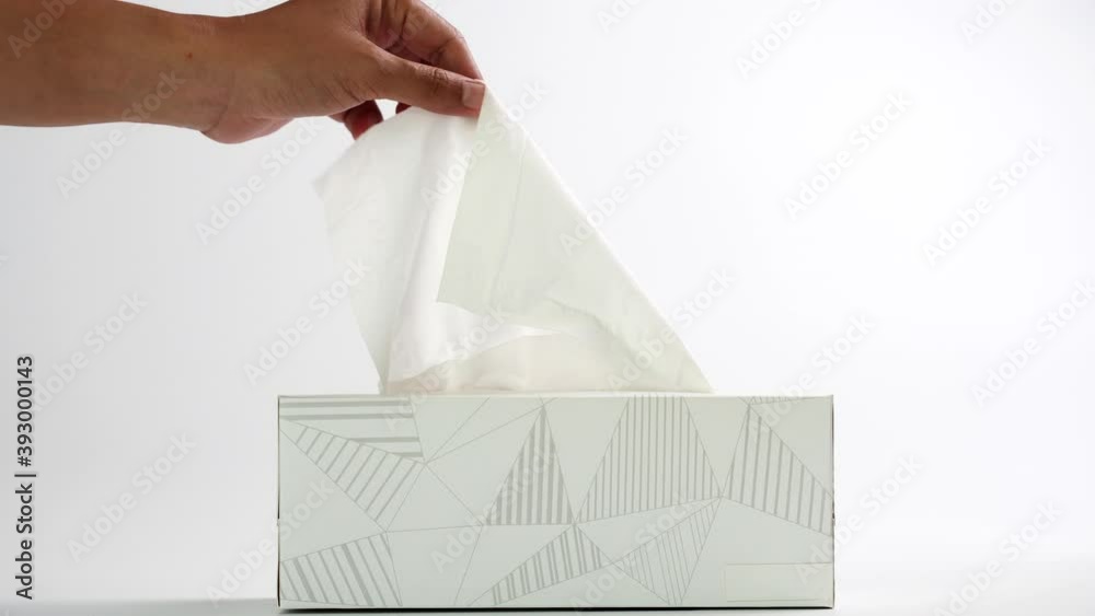 Slow motion woman hand picking white tissue paper from tissue box. Healthcare concept. 