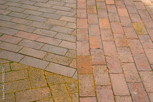 Rough texture and brown color of brick pattern on the walkway