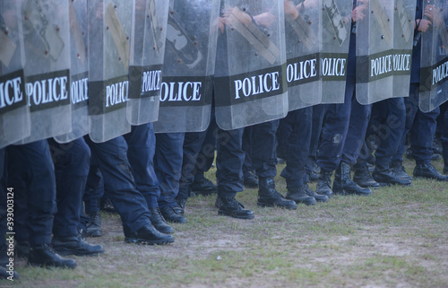 Riot police practice shields and baton 