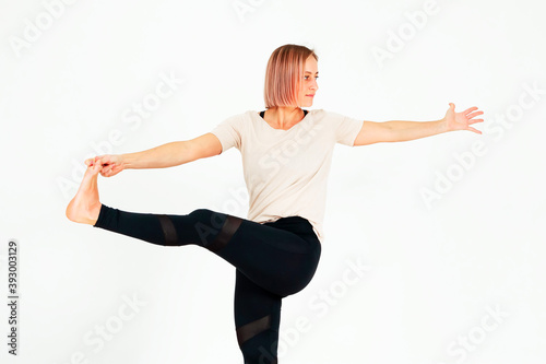 Athletic middle aged woman doing exercises..Hatha yoga