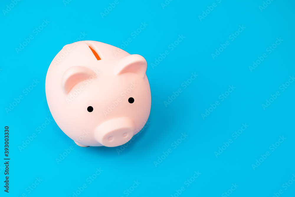 piggy bank on blue background, copy space piggy bank on blue background, copy space