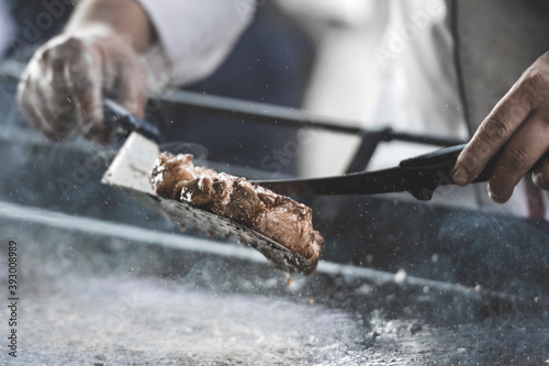Beef steak on the grill with smoke