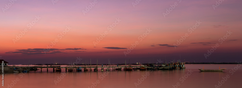 Seascape sunset view at Ang Si La, Chonburi, Thailand. Panorama lanscape witch sky and cloud.