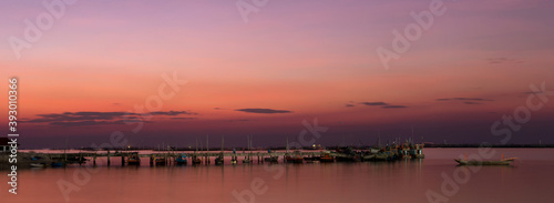 Seascape sunset view at Ang Si La, Chonburi, Thailand. Panorama lanscape witch sky and cloud.