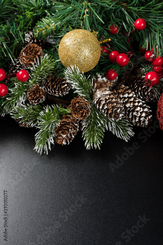 Christmas new year composition on black background. Fir branches  christmas decoration. Flat lay  top view  copy space