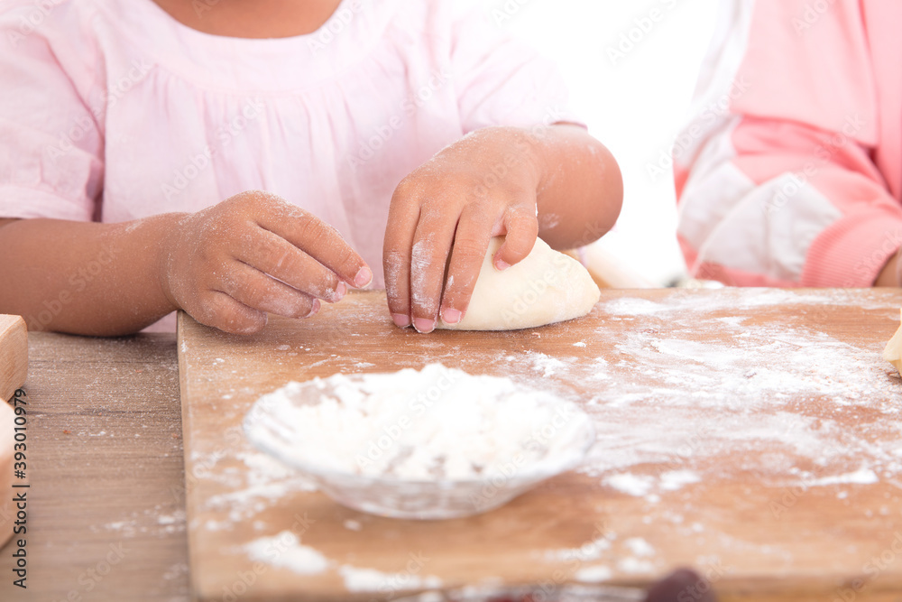 Chinese little girl learning to make moon cakes by hand Chinese little girl learning to make moon cakes by hand
