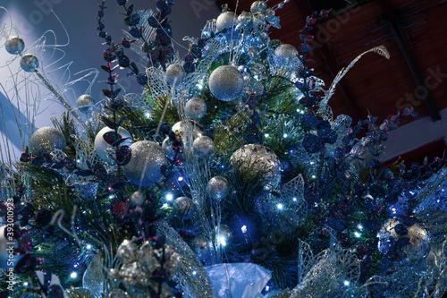 Christmas tree decoration in blue, silver and green colors