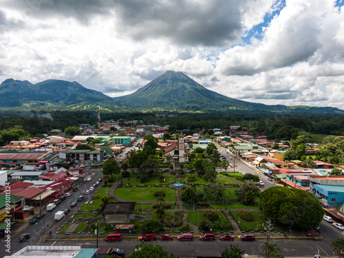 Beautiful aerial view of church in the town of the Fortuna with majestic Arenal Volcano in Costa Rica photo