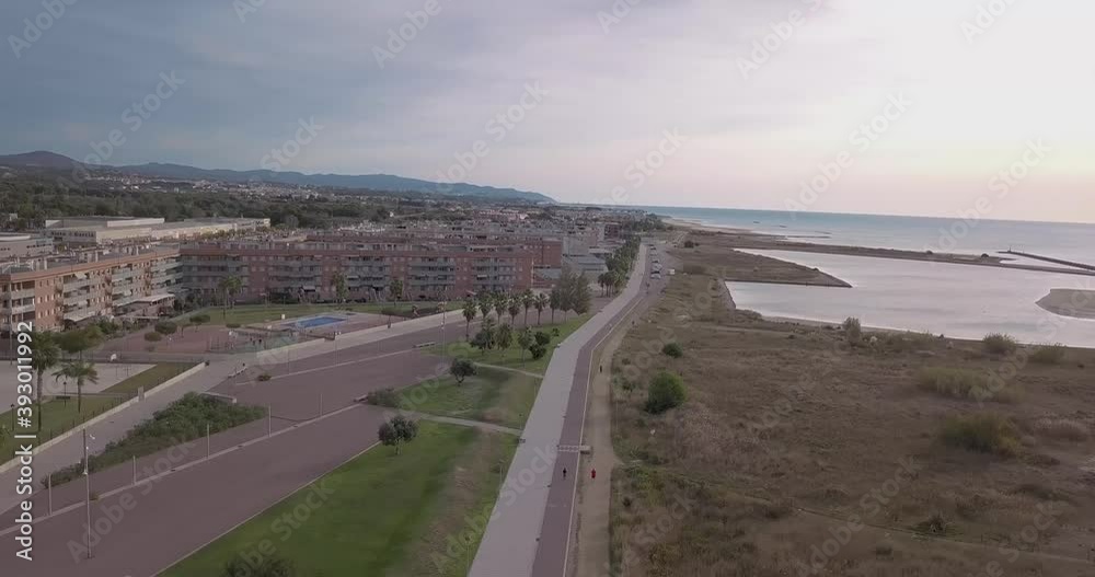 A drone shot of a walk in an industrial village with a beautiful sky A drone shot of a walk in an industrial village with a beautiful sky