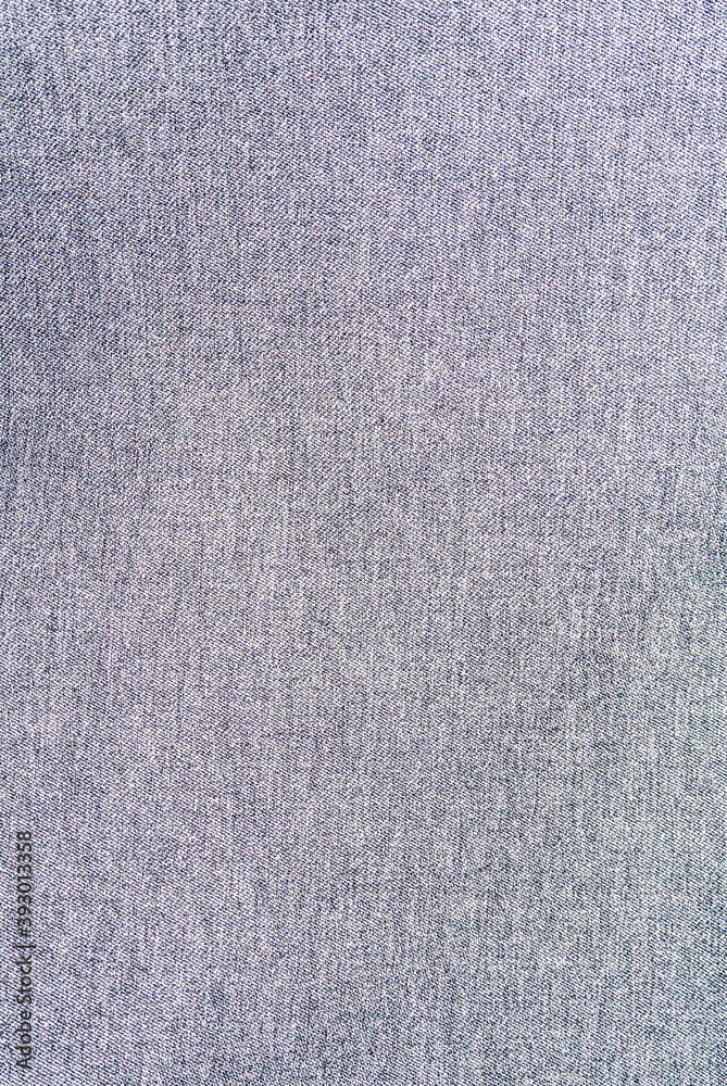 Perspective and closeup view to abstract space of empty natural clean denim texture for the traditional business background in cold bright colors with diagonal shift tilt lines and stitches Perspective and closeup view to abstract space of empty natural clean denim texture for the traditional business background in cold bright colors with diagonal shift tilt lines and stitches