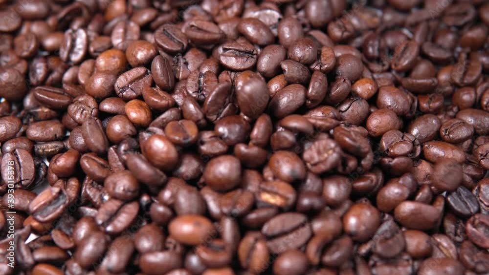 Coffee beans background. Falling coffee beans close up. Coffee beans background. Falling coffee beans close up.