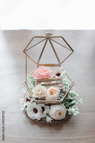 wedding ring on a cage with flowers