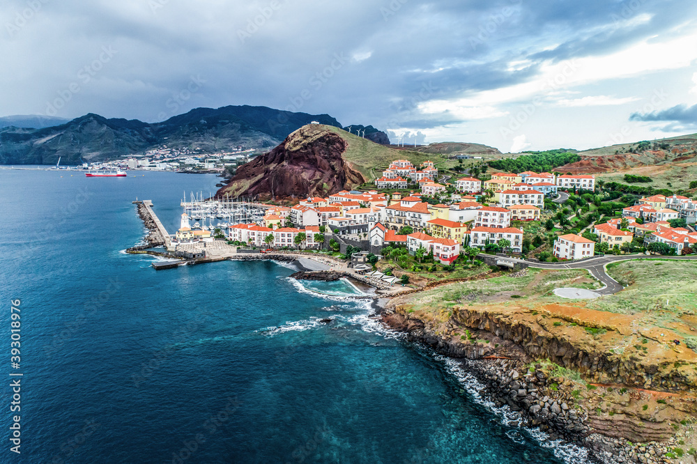 Aerial view of Quinta do Lorde smal village hotel on coast of the Portuguese island of Madeira with small yacht harbour