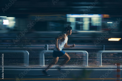 Asian man exercise practicing running at night