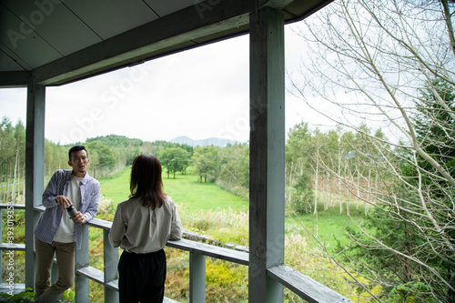 Man and Woman Laughing on the Terrace of Cafe photo