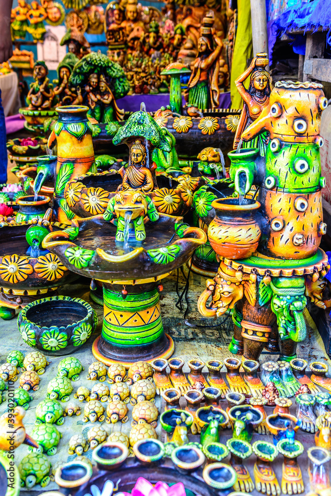 Traditional colorful god statues & souvenir shop at Dilli Haat, New Delhi. Dilli Haat is a craft market located run by Delhi Tourism and Transportation Corporation