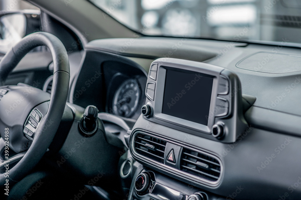 Close-up of car dashboard and steering wheel