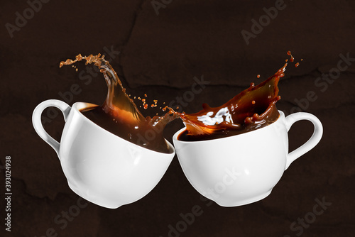 coffee cheers with splash effect on brown stony background
