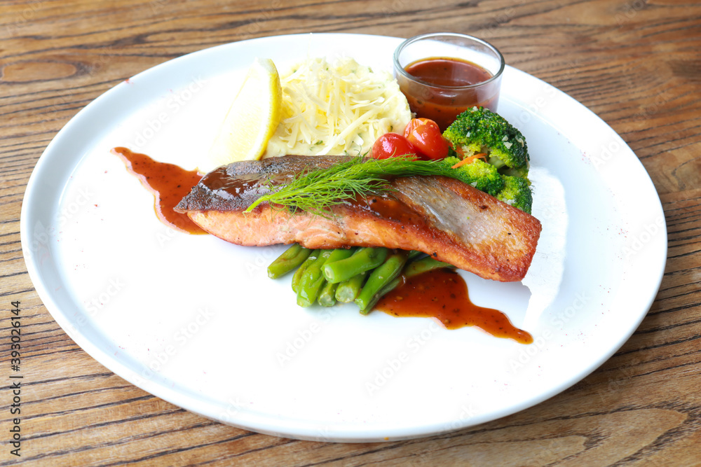Grilled salmon with fresh vegetable salad Grilled salmon with fresh vegetable salad