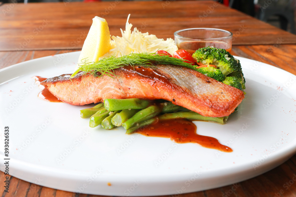 Grilled salmon with fresh vegetable salad Grilled salmon with fresh vegetable salad