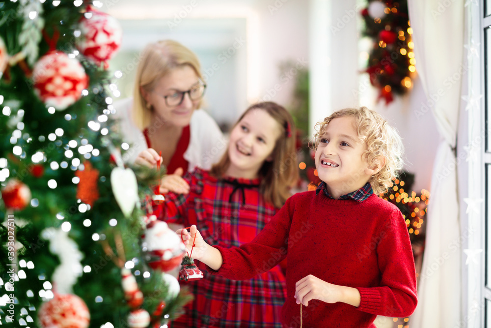Family decorating Christmas tree. Kid on Xmas eve. Family decorating Christmas tree. Kid on Xmas eve.