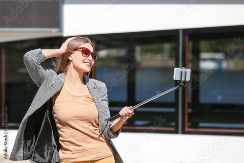Beautiful young woman takin...