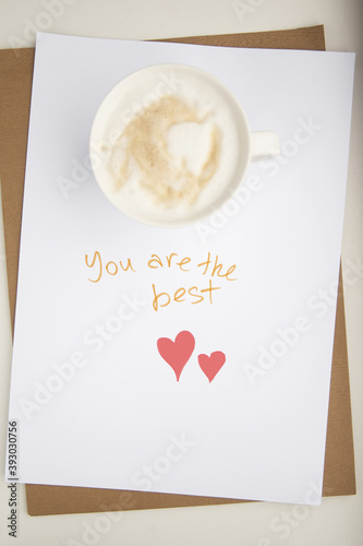 Wishes and care. Motivational lettering and cup of coffee
