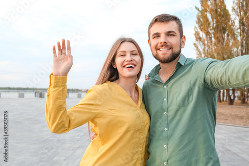Young couple taking selfie ...