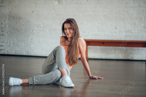 Woman learning dancing movements on the floor © zinkevych