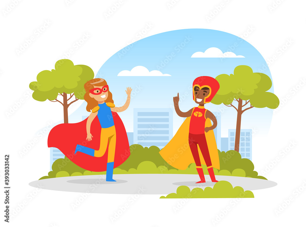 Cute Boy and Girl Dressed in Superhero Costumes Playing Outdoors, Happy Kids Having Fun in Park Cartoon Vector Illustration