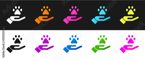 Set Hands with animals footprint icon isolated on black and white background. Pet paw in heart. Love to the animals. Vector.