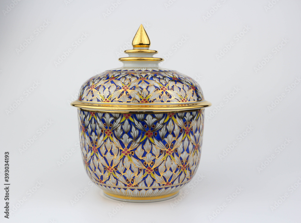 Thai traditional porcelain with lid called Benjarong - It contained of 5 colors art painted in the ceramic , high class art of Thailand isolated on white background Thai traditional porcelain with lid called Benjarong - It contained of 5 colors art painted in the ceramic , high class art of Thailand isolated on white background