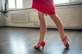Woman wearing heels performing latina dance routine