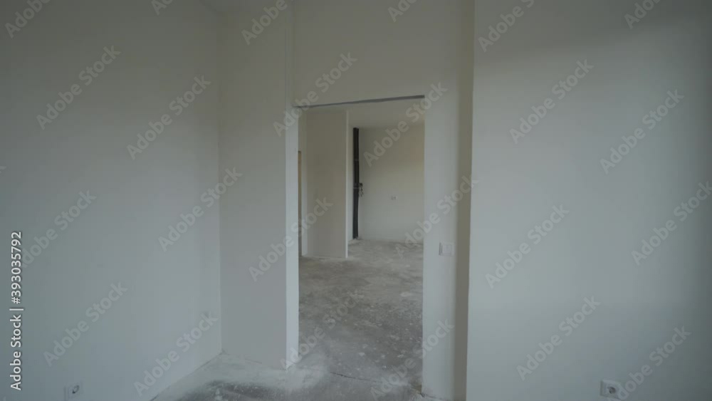 Moving in new apartment, white apartment interior, view of the rooms new home construction. Moving in new apartment, white apartment interior, view of the rooms new home construction.