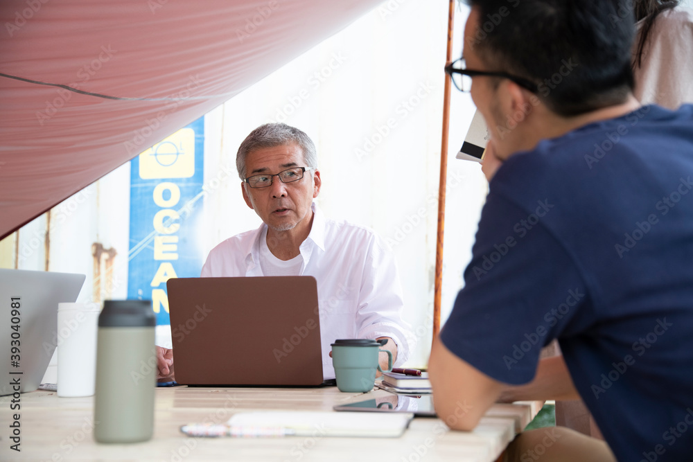 Men and Woman Having a Meeting on an Outdoor Office as New Normal Work Style