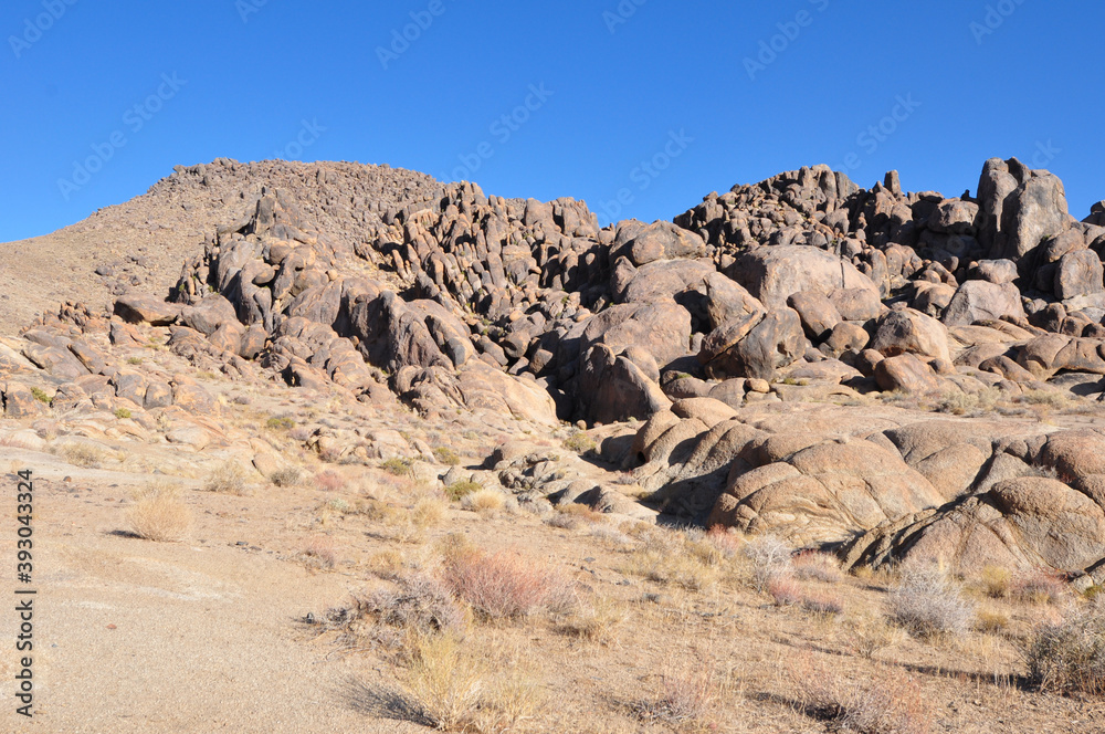 The rocky landscape of the Alabama Hills in California on a bright sunny day
