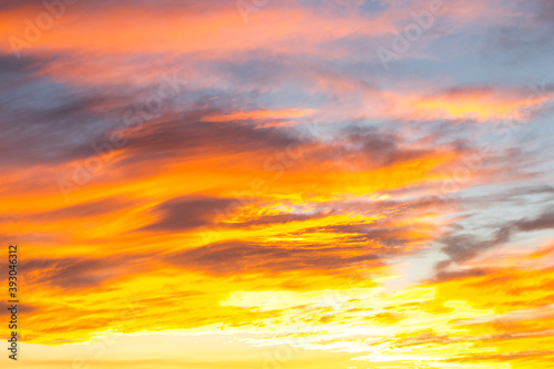 Dramatic yellow and orange colored sunset cloudscape for background or sky replacement photo editing