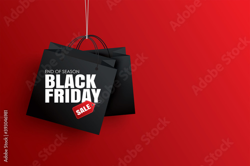 Black friday sale with black shopping bag and the rope hanging on red background