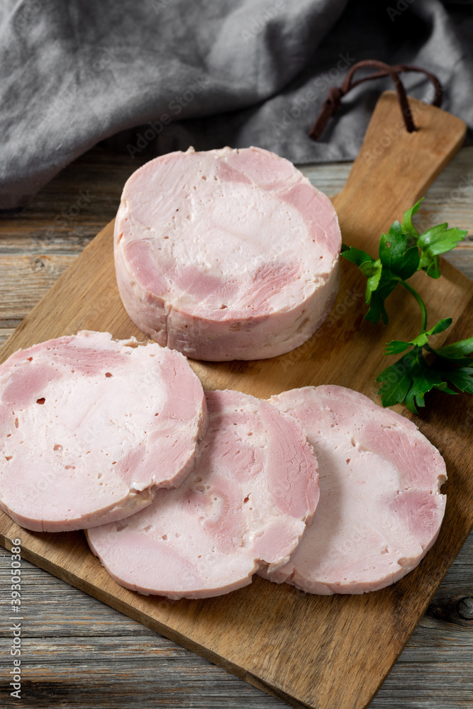 Ham. Spiced ham on a wooden serving Board. Delicious Turkey ham. The sausage product