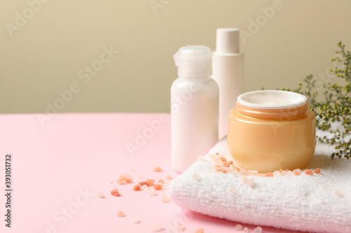 Concept of spa cosmetics on pink table