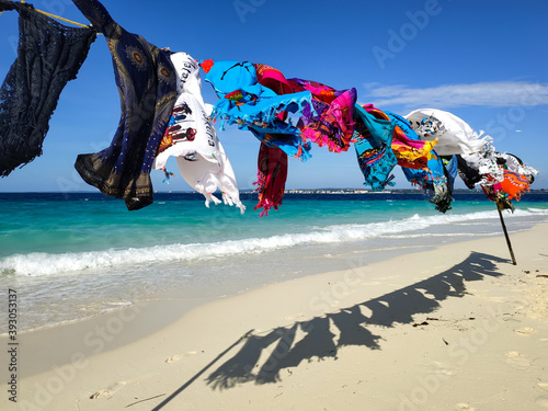 Multi-colored clothes fluttering in the wind on the seashore