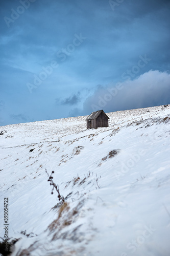 wooden house in winter mountains.