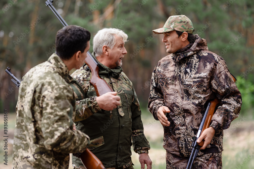 Men with Hunting Rifles Hunters Have Fun Outdoor. Men with Hunting Rifles Hunters Have Fun Outdoor.