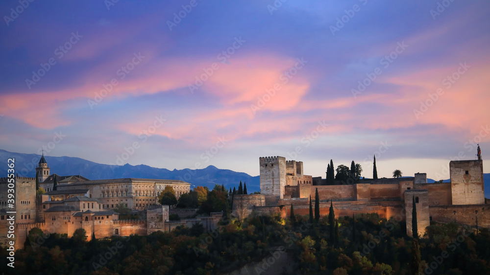 Panoramic view of Alhambra in Granada, Spain. Alhambra fortress and Albaicin quarter at twilight sky scene-Autumn season mood
