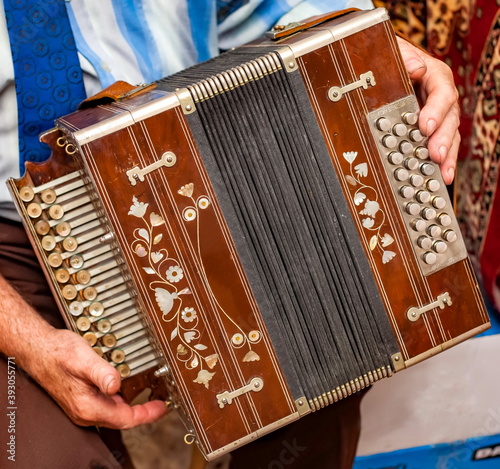 Accordion close-up in the hands of a man
