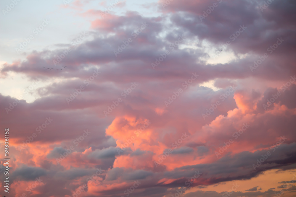 Dramatic big clouds in the vast sunset sky