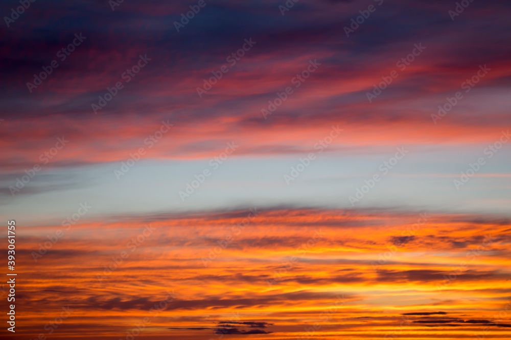 Photograph of the sunset sky dyed in orange as a background material