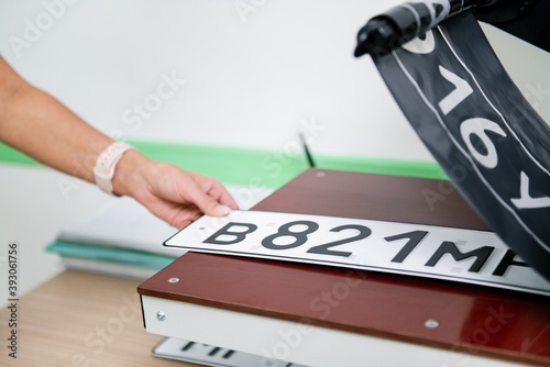 production of numbers for a car on a machine