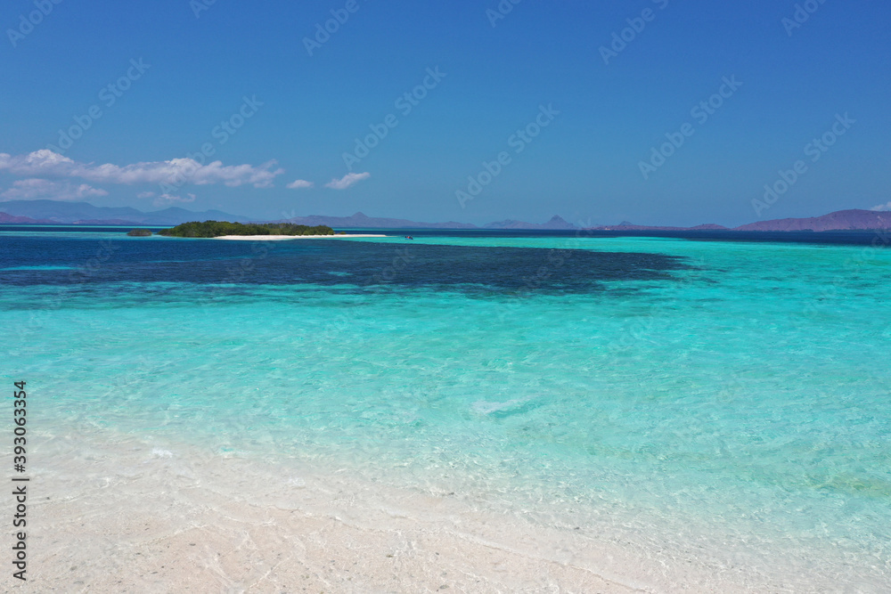 Beautiful tropical beaches and sea with blue background, beach on bright blue sky, background, copy space.