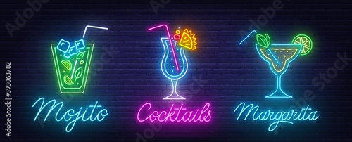 Cocktail Margarita, Blue Hawaiian and Mojito neon sign on brick wall background . photo